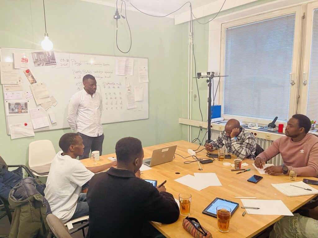 Community members working together in a language classroom
